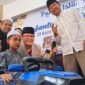 Berprestasi di bidang MTQ,Arreihan (12) anak yatim asal Kecamatan Pujon menerima hadiah motor listrik dari PT.ACA. (Foto : Kim)