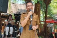 Kadis Kominfo Kota Batu, Aries Setyawan menyampaikan sambutan di Anniversary 1 Tahun kepengurusan SMSI Malang Raya. Foto (Kim/ngalamutas.com)