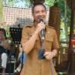 Kadis Kominfo Kota Batu, Aries Setyawan menyampaikan sambutan di Anniversary 1 Tahun kepengurusan SMSI Malang Raya. Foto (Kim/ngalamutas.com)